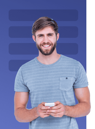 Smiling man holding a smartphone against a blue background